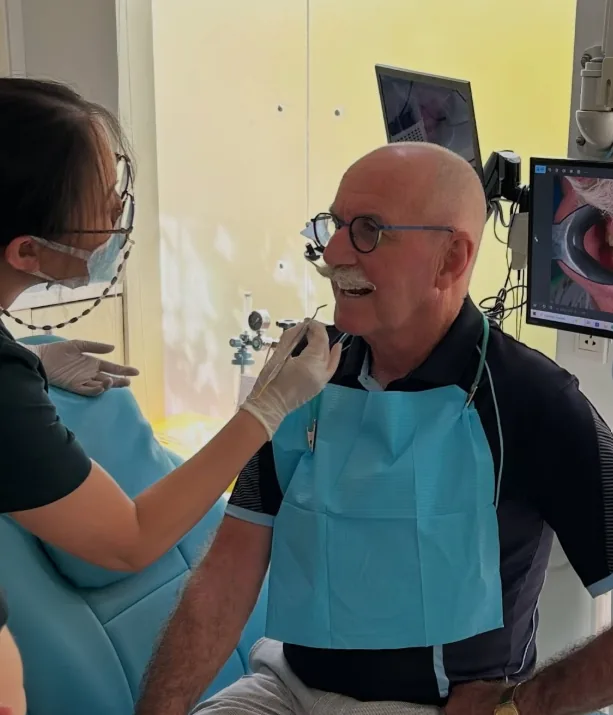 Patient having a dental check at a partner clinic