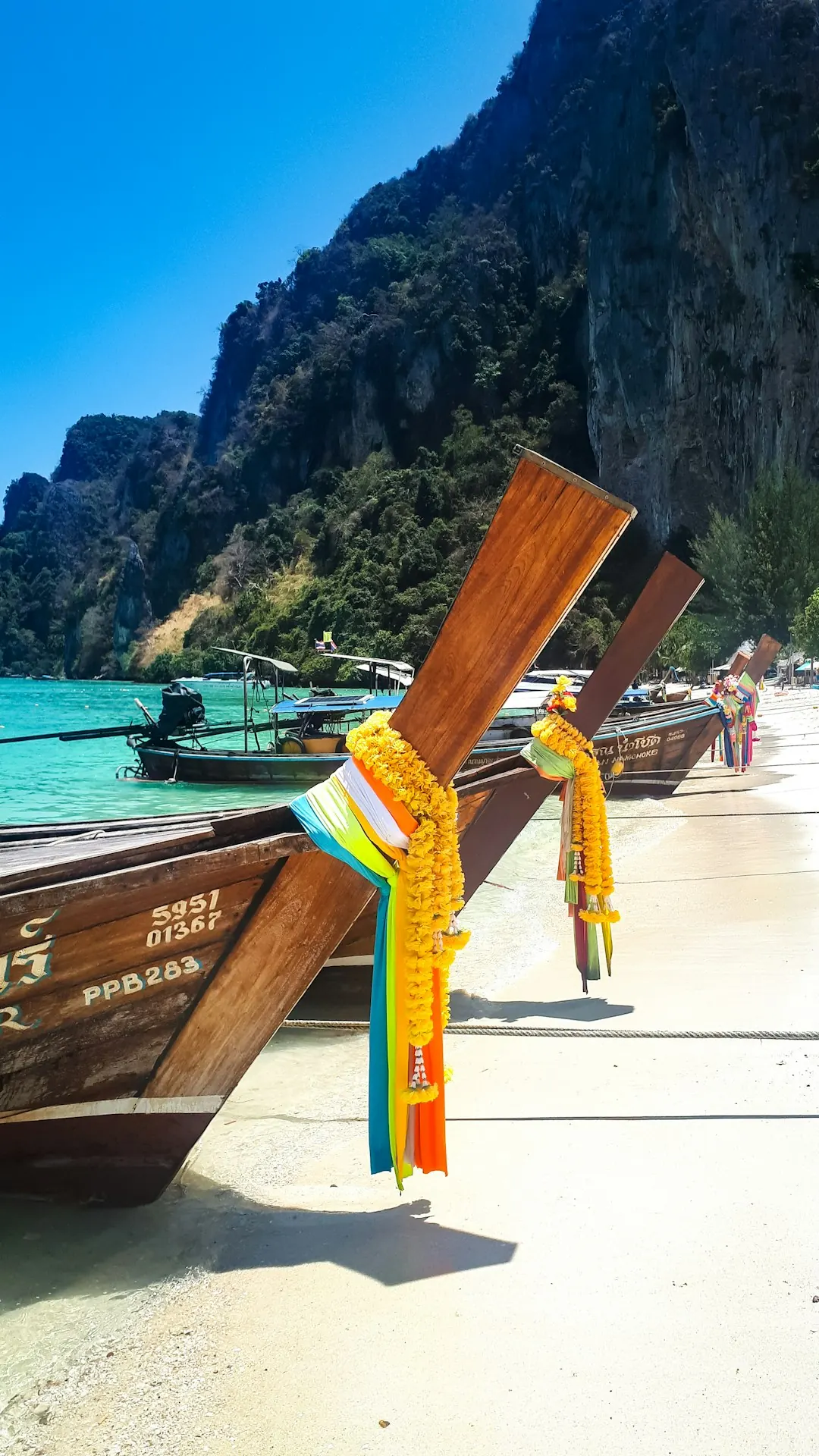 Longtail boat on turquoise water in Thailand